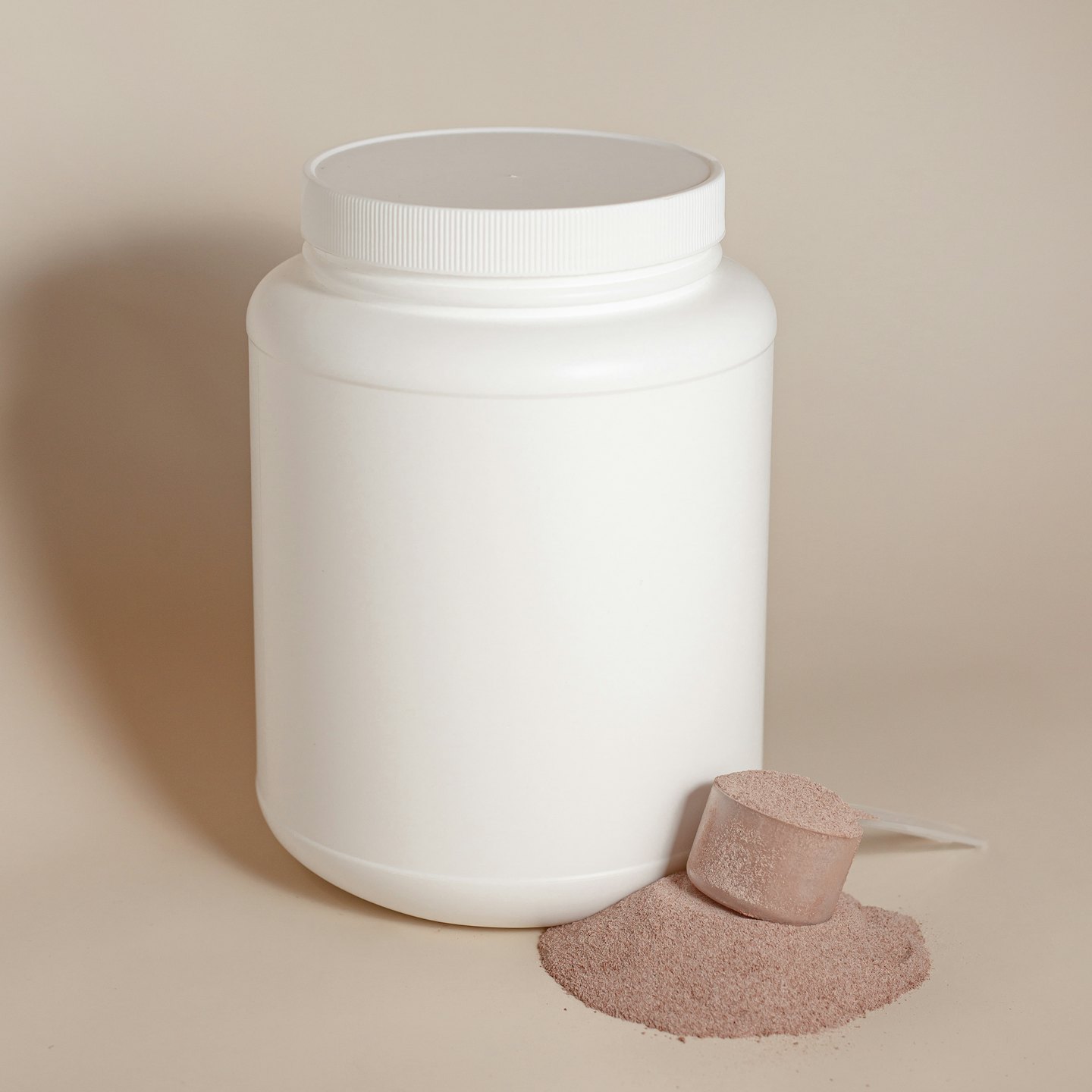 Powdered supplement in a white tub with a scoop.